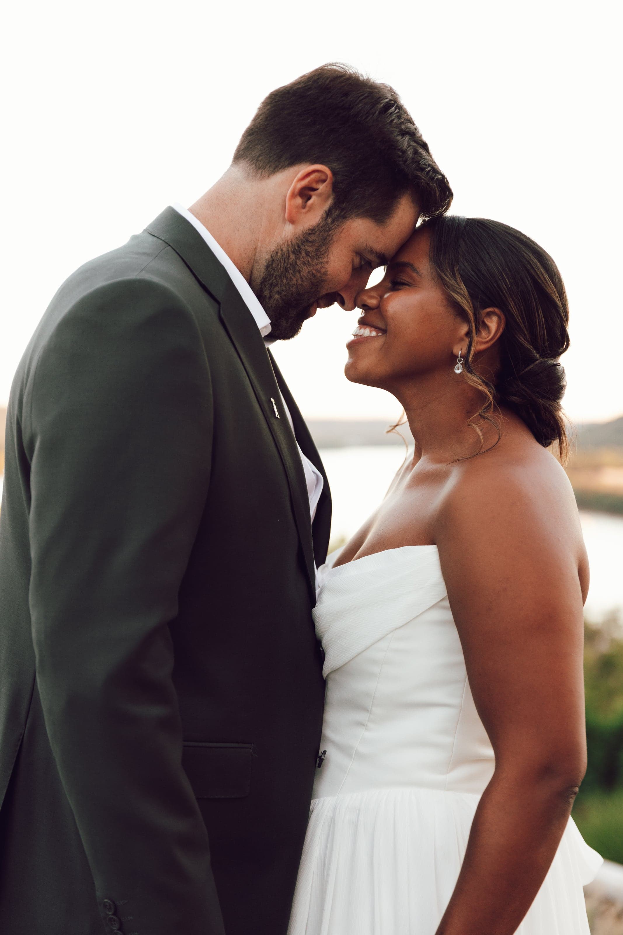 Couple forehead to forehead at golden hour